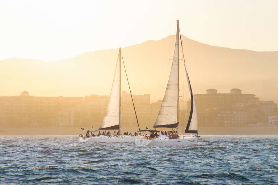 Cabo Luxury Sunset Sailing Adventure with Open Bar - Past the old lighthouse toward El Arco and Lovers Beach