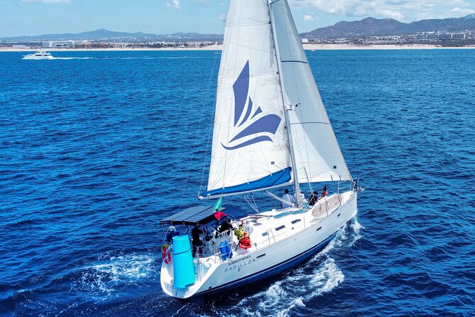 Private Sailboat tour in Cabo San Lucas with Papillon Yachts - Médano Beach: open bar energy and real chill time