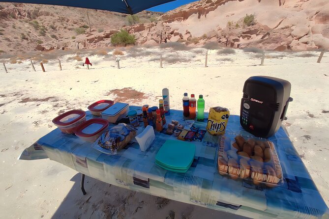 Private Tour to Isla Espiritu Santo and snorkel with sea lions - Ensenada Grande beach time: umbrellas, seats, and a lunch that feels like a reset