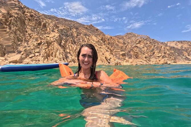 Snorkel Tour in private Trimarán in Los Cabos - On-water setup: floating mat, paddle boards, and easy entry comfort