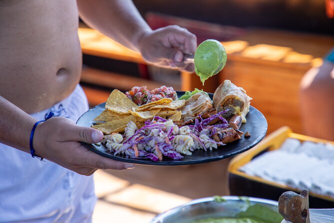 Treasure Hunt Snorkeling Lunch Cruise from Cabo San Lucas - Onboard Entertainment: Games, Music, and Family-Friendly Energy